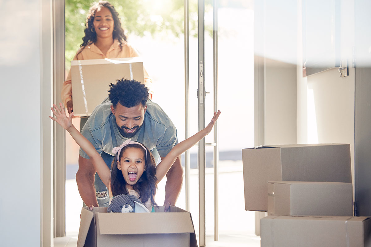 Happy family moving into a new house